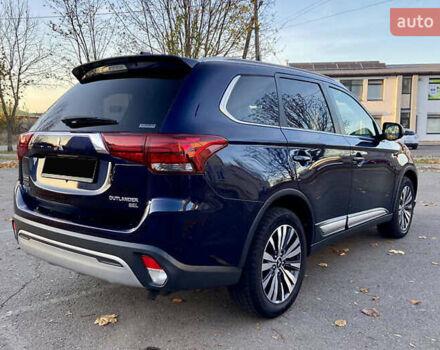 Синий Мицубиси Аутлендер, объемом двигателя 2.36 л и пробегом 71 тыс. км за 13800 $, фото 7 на Automoto.ua