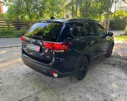 Синий Мицубиси Аутлендер, объемом двигателя 2.4 л и пробегом 75 тыс. км за 15990 $, фото 4 на Automoto.ua