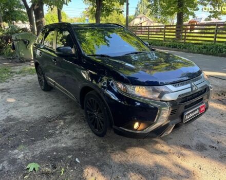 Синий Мицубиси Аутлендер, объемом двигателя 2.4 л и пробегом 75 тыс. км за 15990 $, фото 2 на Automoto.ua