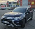 Синий Мицубиси Аутлендер, объемом двигателя 2.4 л и пробегом 106 тыс. км за 17000 $, фото 1 на Automoto.ua