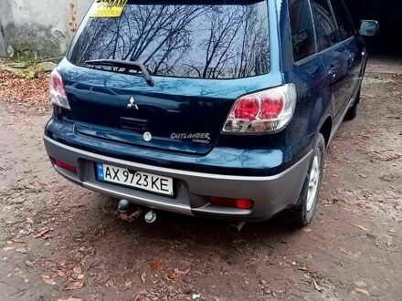 Синий Мицубиси Аутлендер, объемом двигателя 2 л и пробегом 195 тыс. км за 6500 $, фото 1 на Automoto.ua