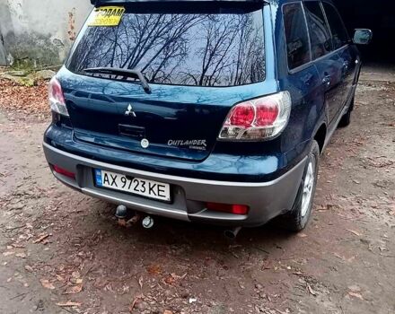 Синий Мицубиси Аутлендер, объемом двигателя 2 л и пробегом 195 тыс. км за 6500 $, фото 1 на Automoto.ua