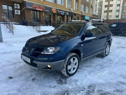 Синий Мицубиси Аутлендер, объемом двигателя 2.4 л и пробегом 280 тыс. км за 4100 $, фото 1 на Automoto.ua