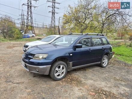 Синий Мицубиси Аутлендер, объемом двигателя 2 л и пробегом 211 тыс. км за 4600 $, фото 1 на Automoto.ua