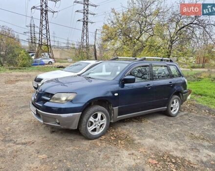 Синий Мицубиси Аутлендер, объемом двигателя 2 л и пробегом 211 тыс. км за 4600 $, фото 1 на Automoto.ua
