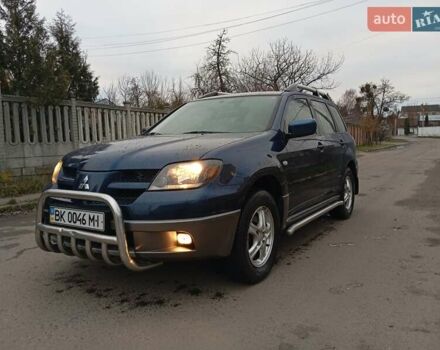 Синий Мицубиси Аутлендер, объемом двигателя 2.38 л и пробегом 175 тыс. км за 6500 $, фото 1 на Automoto.ua