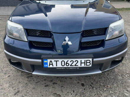 Синий Мицубиси Аутлендер, объемом двигателя 2 л и пробегом 231 тыс. км за 4900 $, фото 1 на Automoto.ua