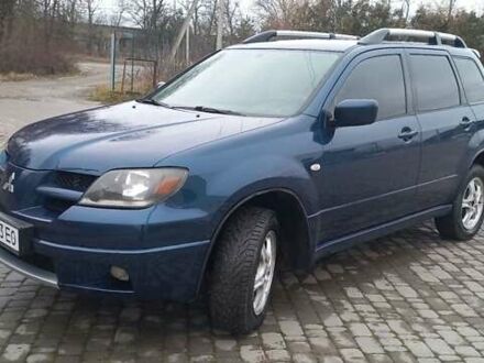 Синий Мицубиси Аутлендер, объемом двигателя 2 л и пробегом 400 тыс. км за 4400 $, фото 1 на Automoto.ua