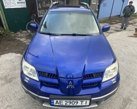 Синий Мицубиси Аутлендер, объемом двигателя 2.4 л и пробегом 220 тыс. км за 4500 $, фото 1 на Automoto.ua