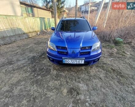 Синий Мицубиси Аутлендер, объемом двигателя 2 л и пробегом 238 тыс. км за 5800 $, фото 1 на Automoto.ua