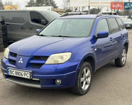 Синий Мицубиси Аутлендер, объемом двигателя 2.4 л и пробегом 245 тыс. км за 4600 $, фото 1 на Automoto.ua