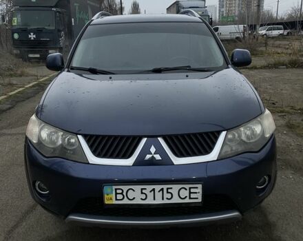 Синий Мицубиси Аутлендер, объемом двигателя 2.4 л и пробегом 250 тыс. км за 6300 $, фото 1 на Automoto.ua