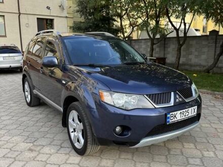 Синий Мицубиси Аутлендер, объемом двигателя 2.36 л и пробегом 223 тыс. км за 8650 $, фото 1 на Automoto.ua