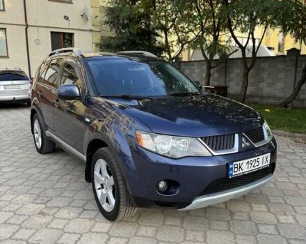Синий Мицубиси Аутлендер, объемом двигателя 2.36 л и пробегом 223 тыс. км за 8650 $, фото 1 на Automoto.ua
