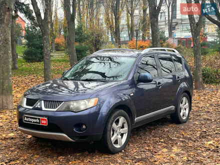 Синий Мицубиси Аутлендер, объемом двигателя 2.4 л и пробегом 211 тыс. км за 8390 $, фото 1 на Automoto.ua