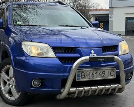 Синий Мицубиси Аутлендер, объемом двигателя 2 л и пробегом 236 тыс. км за 6200 $, фото 1 на Automoto.ua