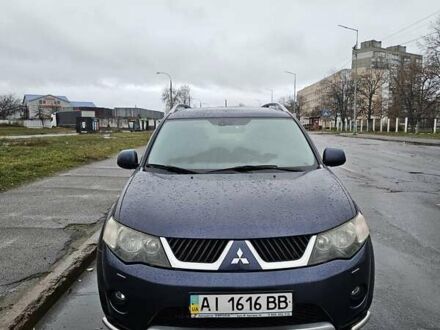 Синий Мицубиси Аутлендер, объемом двигателя 2.4 л и пробегом 282 тыс. км за 10500 $, фото 1 на Automoto.ua