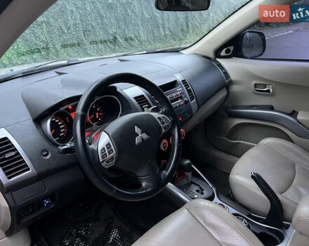 Синий Мицубиси Аутлендер, объемом двигателя 2.4 л и пробегом 158 тыс. км за 7800 $, фото 1 на Automoto.ua