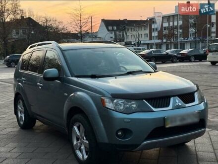Синий Мицубиси Аутлендер, объемом двигателя 2.4 л и пробегом 207 тыс. км за 7800 $, фото 1 на Automoto.ua