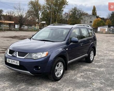 Синий Мицубиси Аутлендер, объемом двигателя 2.4 л и пробегом 94 тыс. км за 8800 $, фото 1 на Automoto.ua