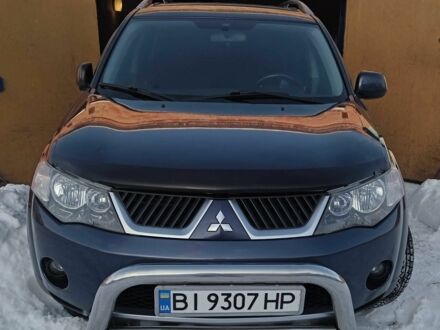 Синий Мицубиси Аутлендер, объемом двигателя 2.4 л и пробегом 200 тыс. км за 8100 $, фото 1 на Automoto.ua