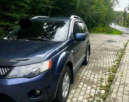 Синий Мицубиси Аутлендер, объемом двигателя 2.4 л и пробегом 284 тыс. км за 9250 $, фото 1 на Automoto.ua