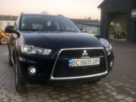 Синий Мицубиси Аутлендер, объемом двигателя 2 л и пробегом 235 тыс. км за 8800 $, фото 1 на Automoto.ua