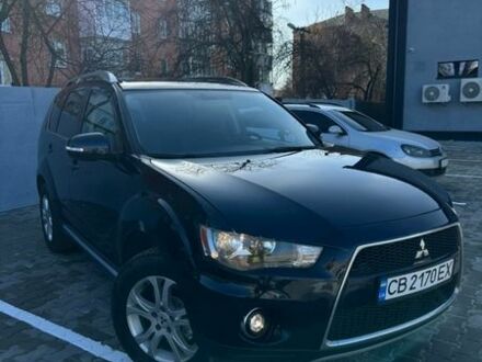 Синий Мицубиси Аутлендер, объемом двигателя 2 л и пробегом 207 тыс. км за 10700 $, фото 1 на Automoto.ua