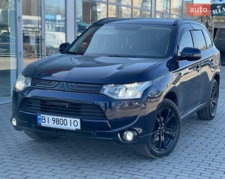 Синий Мицубиси Аутлендер, объемом двигателя 2.4 л и пробегом 180 тыс. км за 12750 $, фото 1 на Automoto.ua