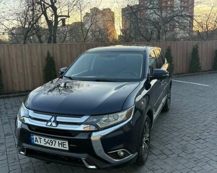 Синий Мицубиси Аутлендер, объемом двигателя 2.38 л и пробегом 99 тыс. км за 15400 $, фото 1 на Automoto.ua