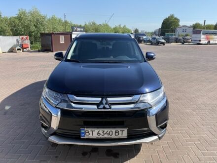 Синий Мицубиси Аутлендер, объемом двигателя 2.4 л и пробегом 68 тыс. км за 15000 $, фото 1 на Automoto.ua