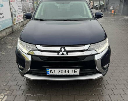 Синий Мицубиси Аутлендер, объемом двигателя 2.4 л и пробегом 154 тыс. км за 15000 $, фото 1 на Automoto.ua