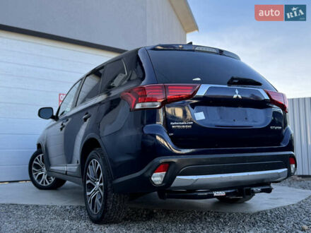 Синий Мицубиси Аутлендер, объемом двигателя 2.4 л и пробегом 152 тыс. км за 11800 $, фото 1 на Automoto.ua