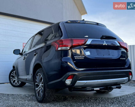 Синій Міцубісі Аутлендер, об'ємом двигуна 2.4 л та пробігом 152 тис. км за 11800 $, фото 1 на Automoto.ua