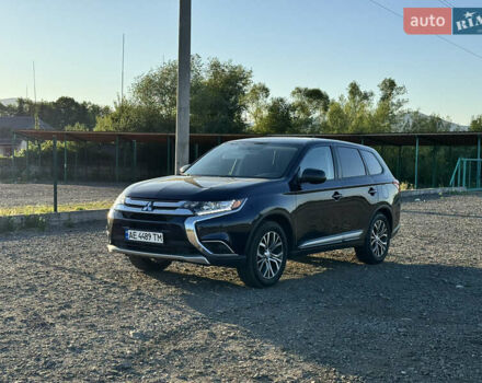 Синий Мицубиси Аутлендер, объемом двигателя 2.36 л и пробегом 105 тыс. км за 14700 $, фото 1 на Automoto.ua