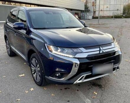Синий Мицубиси Аутлендер, объемом двигателя 2.4 л и пробегом 71 тыс. км за 11800 $, фото 1 на Automoto.ua
