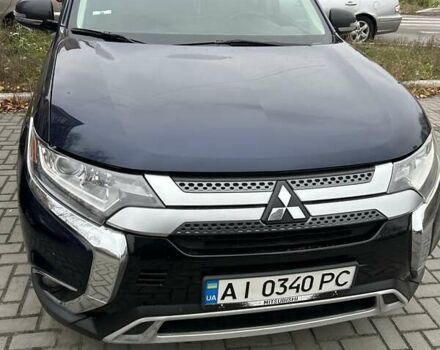 Синий Мицубиси Аутлендер, объемом двигателя 2.36 л и пробегом 129 тыс. км за 16500 $, фото 1 на Automoto.ua