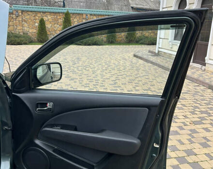 Зеленый Мицубиси Аутлендер, объемом двигателя 2.38 л и пробегом 250 тыс. км за 7200 $, фото 35 на Automoto.ua