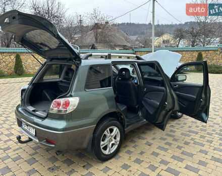 Зеленый Мицубиси Аутлендер, объемом двигателя 2.38 л и пробегом 250 тыс. км за 7200 $, фото 38 на Automoto.ua