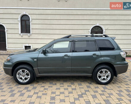 Зеленый Мицубиси Аутлендер, объемом двигателя 2.38 л и пробегом 250 тыс. км за 7200 $, фото 12 на Automoto.ua