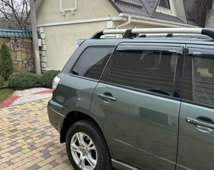 Зеленый Мицубиси Аутлендер, объемом двигателя 2.38 л и пробегом 250 тыс. км за 7200 $, фото 44 на Automoto.ua