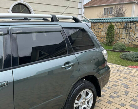 Зеленый Мицубиси Аутлендер, объемом двигателя 2.38 л и пробегом 250 тыс. км за 7200 $, фото 28 на Automoto.ua