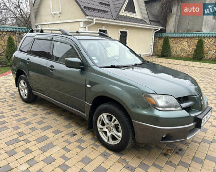 Зеленый Мицубиси Аутлендер, объемом двигателя 2.38 л и пробегом 250 тыс. км за 7200 $, фото 42 на Automoto.ua