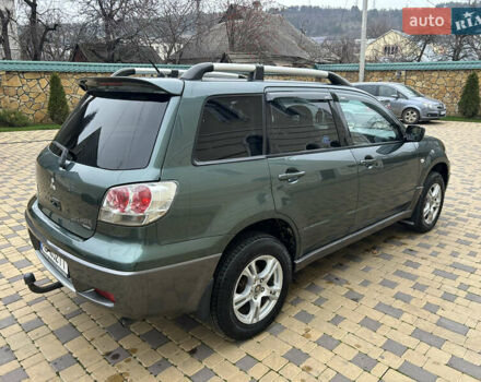 Зеленый Мицубиси Аутлендер, объемом двигателя 2.38 л и пробегом 250 тыс. км за 7200 $, фото 14 на Automoto.ua