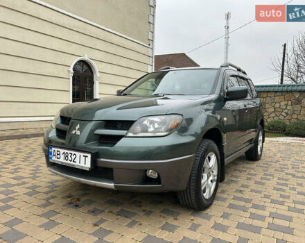 Зеленый Мицубиси Аутлендер, объемом двигателя 2.38 л и пробегом 250 тыс. км за 7200 $, фото 26 на Automoto.ua