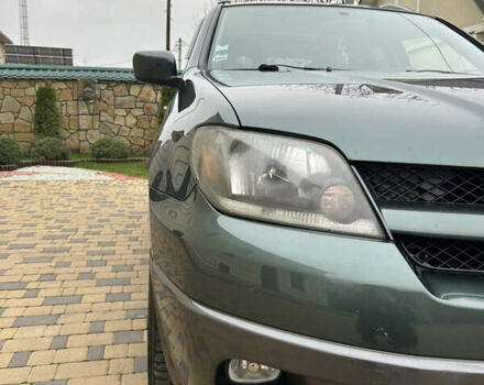 Зеленый Мицубиси Аутлендер, объемом двигателя 2.38 л и пробегом 250 тыс. км за 7200 $, фото 23 на Automoto.ua