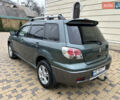 Зеленый Мицубиси Аутлендер, объемом двигателя 2.38 л и пробегом 250 тыс. км за 7200 $, фото 21 на Automoto.ua
