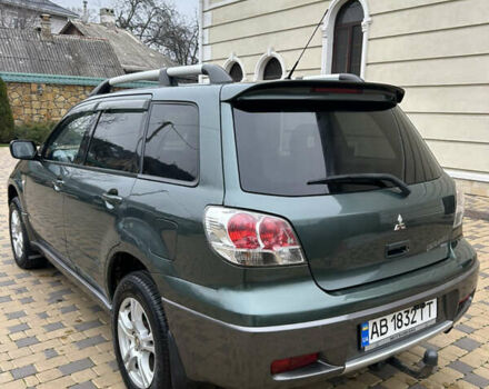 Зеленый Мицубиси Аутлендер, объемом двигателя 2.38 л и пробегом 250 тыс. км за 7200 $, фото 3 на Automoto.ua