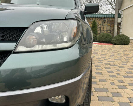 Зеленый Мицубиси Аутлендер, объемом двигателя 2.38 л и пробегом 250 тыс. км за 7200 $, фото 22 на Automoto.ua