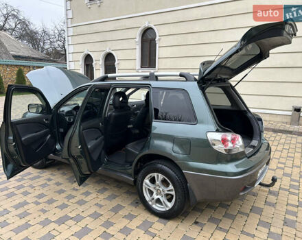 Зеленый Мицубиси Аутлендер, объемом двигателя 2.38 л и пробегом 250 тыс. км за 7200 $, фото 40 на Automoto.ua